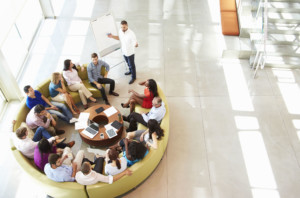Businessman making presentation to office colleagues